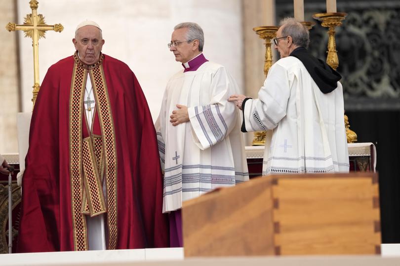 Pope Francis stands by the coffin of late Pope Emeritus Benedict XVI at St. Peter's Square during a funeral mass.