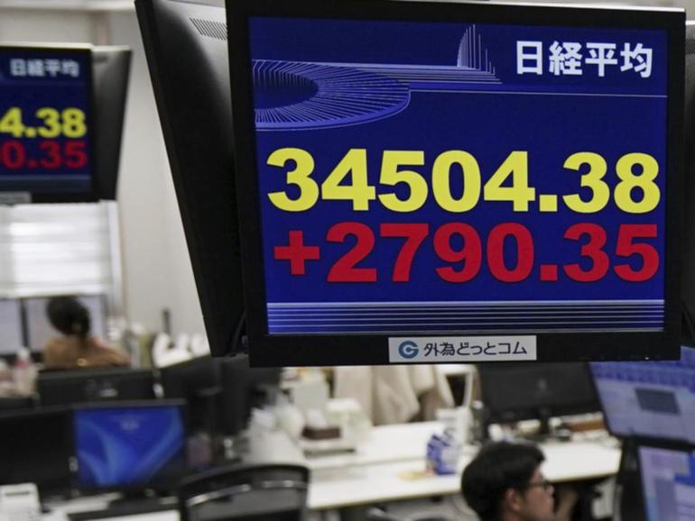 Japan's Nikkei has eased a modest 0.3 per cent in morning trade. (AP PHOTO)